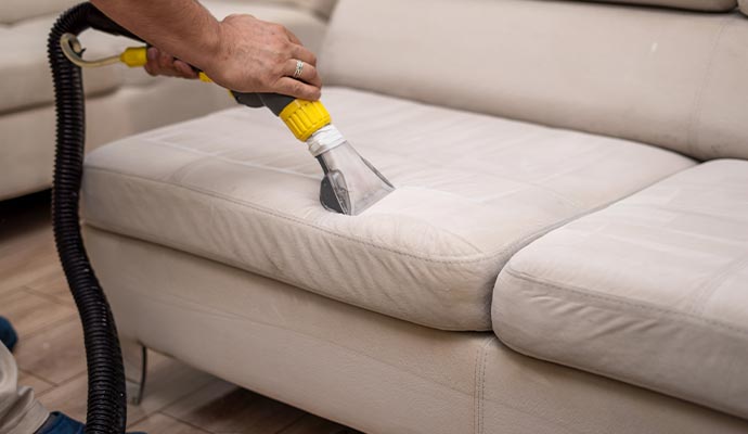 sofa cleaning with vacuum cleaner