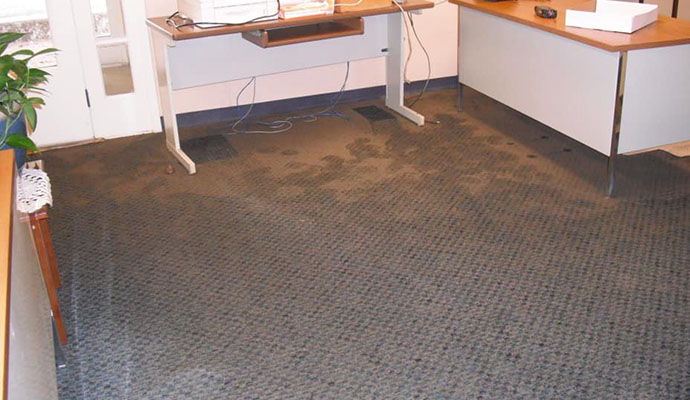 room with wet and water damaged carpet