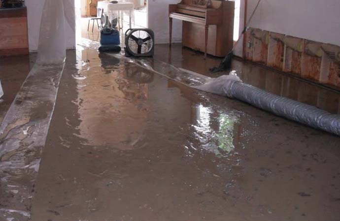 Flooded room with water damage restoration