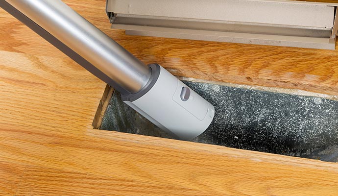 Professional vent cleaning using vacuum