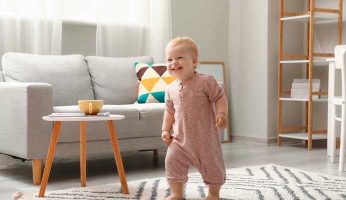 Kid walking on a rug